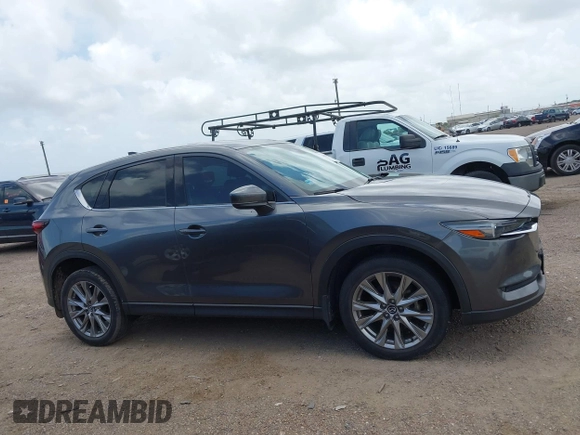 2021 Mazda CX-5 Grand Touring with VIN JM3KFBDM2M0431484, listed as a IAAI auction lot 42547665 with 34,757 mi miles and . Bid and sale history available at DreamBid. Image 14.