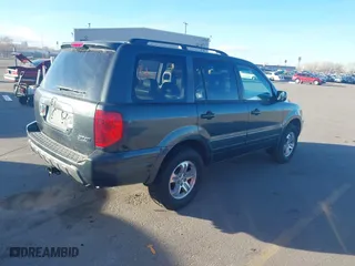 2005 Honda Pilot EX-L with NAVI with VIN 2HKYF18775H553666, listed as a IAAI auction lot 41858179 with 241,011 mi miles. Bid and sale history available at carsss.com. Image 4.