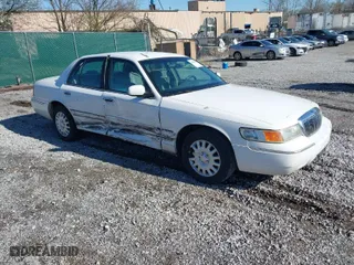 1999 Mercury Grand Marquis GS with VIN 2MEFM74W0XX686623, listed as a IAAI auction lot 41828993 with 245,171 mi miles. Bid and sale history available at carsss.com. Image 1.