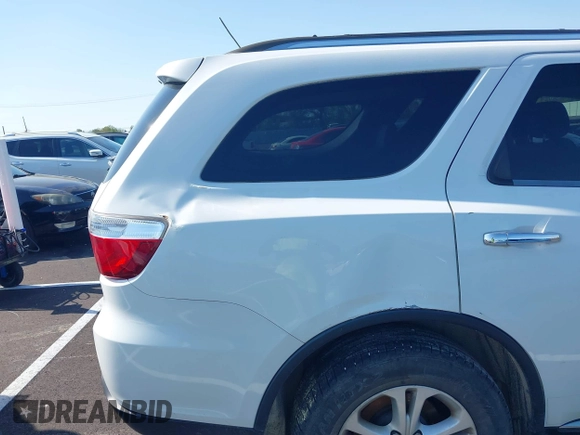 2013 Dodge Durango Crew with VIN 1C4RDJDG0DC670810, listed as a IAAI auction lot 41974024 with 209,379 mi miles and . Bid and sale history available at DreamBid. Image 6.