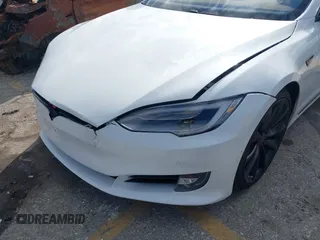 2016 Tesla Model S 90D with VIN 5YJSA1E27GF153525, listed as a IAAI auction lot 41539221 with 145,771 mi miles and . Bid and sale history available at DreamBid. Image 6.