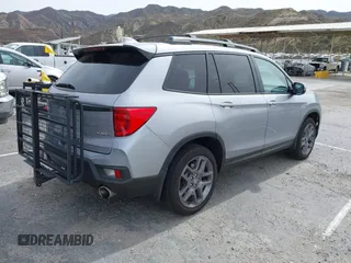 2023 Honda Passport EX-L with VIN 5FNYF8H53PB034963, listed as a IAAI auction lot 41686154 with 12,572 mi miles and . Bid and sale history available at carsss.com. Image 4.
