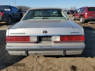 1991 Mercury Grand Marquis z VIN 2MECM74F4MX647208, wystawiony jako Copart lot #48439705 z przebiegiem 99 952 mil mil oraz Tytuł czysty. Historia ofert i sprzedaży dostępna na DreamBid. Obrazek 6.