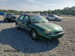 1999 Ford Taurus SE with VIN 1FAFP53U2XG184723, listed as a Copart auction lot 60787115 with 128,277 mi miles and Salvage title. Bid and sale history available at DreamBid. Image 13.