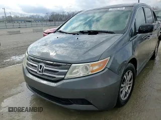 2013 Honda Odyssey EX z VIN 5FNRL5H40DB033400, wystawiony jako Copart lot #50552155 z przebiegiem 223 770 mil mil oraz Nie do naprawy. Historia ofert i sprzedaży dostępna na DreamBid. Obrazek 14.