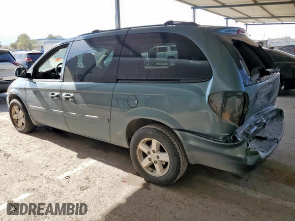 2005 Dodge Caravan SXT with VIN 2D4GP44L75R335536, listed as a Copart auction lot 60933985 with 212,231 mi miles and Salvage title. Bid and sale history available at DreamBid. Image 2.