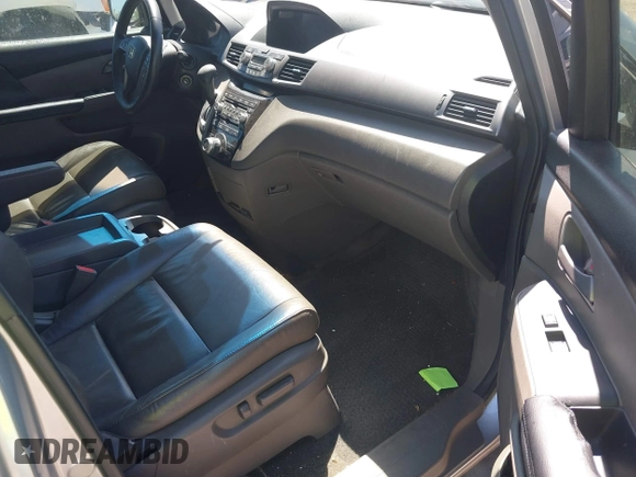 2012 Honda Odyssey Touring with VIN 5FNRL5H90CB099519, listed as a IAAI auction lot 41854550 with 185,110 mi miles. Bid and sale history available at carsss.com. Image 5.