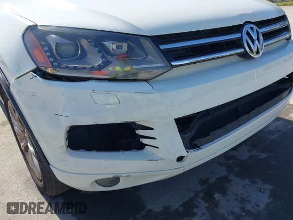 2012 Volkswagen Touareg Sport with VIN WVGEF9BP5CD007294, listed as a IAAI auction lot 41841268 with 160,883 mi miles and . Bid and sale history available at DreamBid. Image 6.
