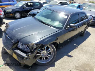 2005 Chrysler 300 with VIN 2C3JA43R95H161005, listed as a Copart auction lot 60951874 with 147,903 mi miles and Salvage Title. Bid and sale history available at carsss.com. Image 1.