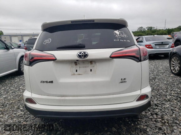 2018 Toyota RAV4 LE with VIN 2T3BFREV3JW764258, listed as a Copart auction lot 61234155 with Not provided miles and Salvage title. Bid and sale history available at DreamBid. Image 6.