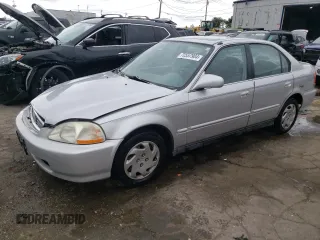 1997 Honda Civic EX with VIN 1HGEJ8647VL018949, listed as a Copart auction lot 72557904 with 162,531 mi miles and Salvage Title. Bid and sale history available at carsss.com. Image 1.