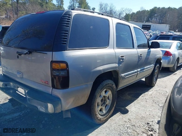 2005 GMC Yukon SLT with VIN 1GKEC13TX5J104235, listed as a IAAI auction lot 41574343 with 291,358 mi miles. Bid and sale history available at carsss.com. Image 4.