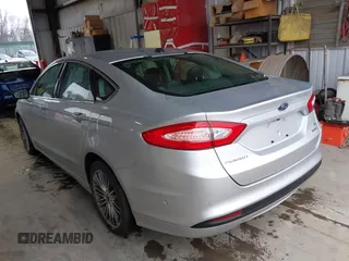 2013 Ford Fusion SE Hybrid with VIN 3FA6P0LU2DR319335, listed as a IAAI auction lot 42007573 with 135,099 mi miles. Bid and sale history available at carsss.com. Image 3.