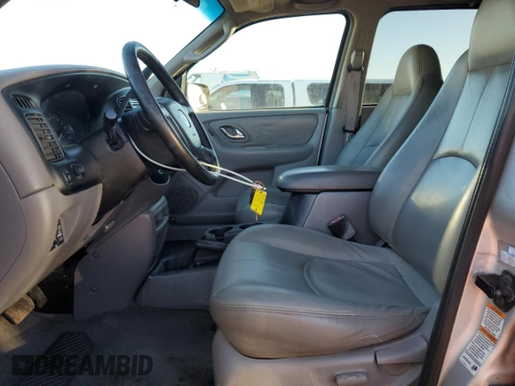 2001 Mazda Tribute LX with VIN 4F2CU08111KM20113, listed as a Copart auction lot 87681195 with 144,400 mi miles and Salvage Title. Bid and sale history available at DreamBid. Image 7.