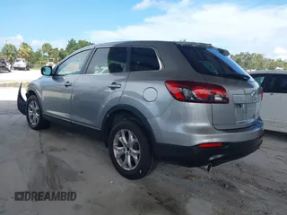 2015 Mazda CX-9 Sport with VIN JM3TB2BA0F0447436, listed as a IAAI auction lot 42480482 with 127,557 mi miles and . Bid and sale history available at DreamBid. Image 3.