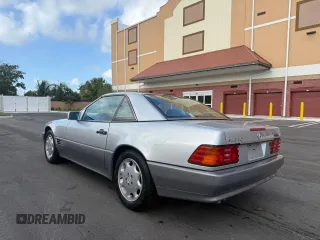 1994 Mercedes-Benz SL z VIN WDBFA63E0RF094472, wystawiony jako Copart lot #58923925 z przebiegiem 55 706 mil mil oraz Tytuł czysty. Historia ofert i sprzedaży dostępna na DreamBid. Obrazek 3.