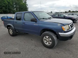 2000 Nissan Frontier XE with VIN 1N6ED27T3YC343320, listed as a Copart auction lot 64883025 with 168,047 mi miles and Clean title. Bid and sale history available at DreamBid. Image 4.