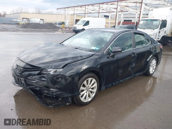 2019 Toyota Camry LE with VIN 4T1B11HK2KU263910, listed as a IAAI auction lot 42060008 with 31,433 mi miles and . Bid and sale history available at DreamBid. Image 2.