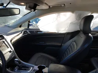 2016 Ford Fusion Energi SE Luxury with VIN 3FA6P0PU5GR373212, listed as a IAAI auction lot 41875297 with 93,049 mi miles. Bid and sale history available at carsss.com. Image 5.
