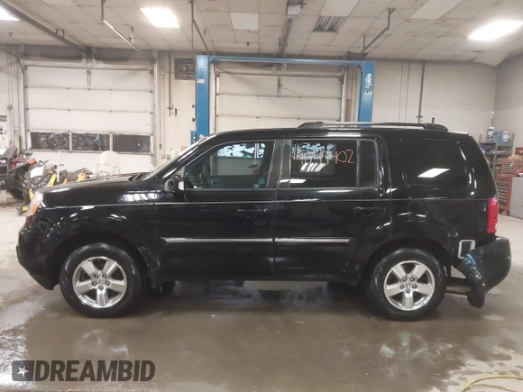 2012 Honda Pilot Touring with VIN 5FNYF4H91CB067014, listed as a IAAI auction lot 41749402 with 151,248 mi miles. Bid and sale history available at carsss.com. Image 14.
