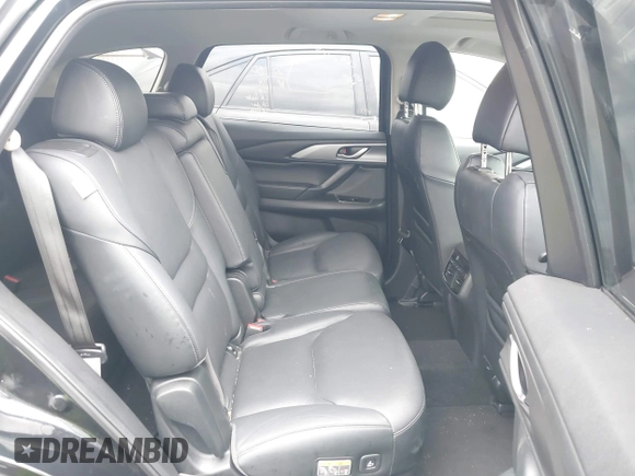 2023 Mazda CX-9 Touring Plus with VIN JM3TCBAY2P0657825, listed as a IAAI auction lot 42756562 with 52,090 mi miles and . Bid and sale history available at DreamBid. Image 8.