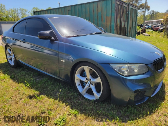2012 BMW 3 Series 335i with VIN WBAKG7C51CE802713, listed as a IAAI auction lot 42032267 with 124,349 mi miles. Bid and sale history available at carsss.com. Image 2.
