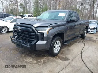 2023 Toyota Tundra with VIN 5TFKB5GDXPX002218, listed as a IAAI auction lot 41932719 with 71,335 mi miles and . Bid and sale history available at DreamBid. Image 2.