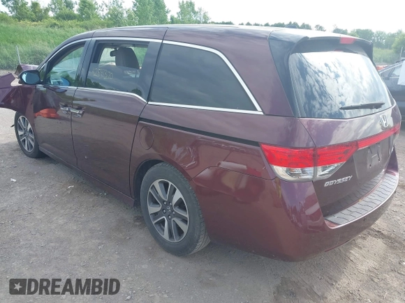 2014 Honda Odyssey Touring with VIN 5FNRL5H90EB120999, listed as a IAAI auction lot 42541370 with 96,454 mi miles and . Bid and sale history available at DreamBid. Image 3.