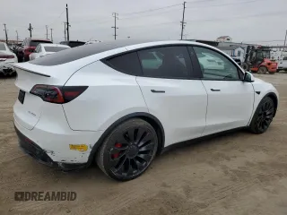 2022 Tesla Model Y Performance with VIN 7SAYGDEF1NF410241, listed as a Copart auction lot 55359505 with 42,652 mi miles and Salvage Title. Bid and sale history available at DreamBid. Image 3.