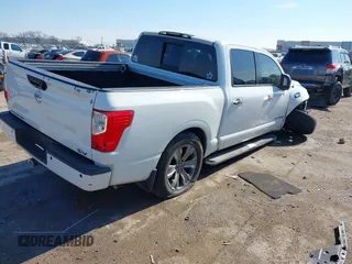 2017 Nissan Titan SL with VIN 1N6AA1E64HN565318, listed as a IAAI auction lot 41322120 with 114,515 mi miles and . Bid and sale history available at DreamBid. Image 4.