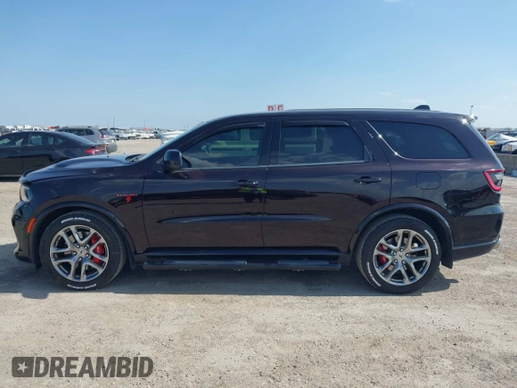 2023 Dodge Durango R/T Plus z VIN 1C4SDJCT2PC693591, wystawiony jako IAAI lot #41858050 z przebiegiem 9 238 mil mil oraz . Historia ofert i sprzedaży dostępna na DreamBid. Obrazek 14.