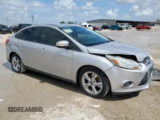 2013 Ford Focus SE with VIN 1FADP3F22DL263124, listed as a Copart auction lot 61583795 with 133,522 mi miles and Salvage title. Bid and sale history available at DreamBid. Image 4.