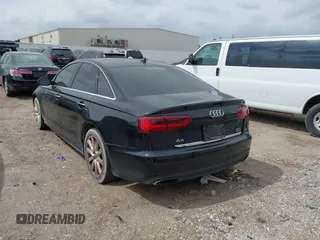 2016 Audi A6 2.0T Premium Plus with VIN WAUGFAFC1GN012799, listed as a IAAI auction lot 42141346 with 101,506 mi miles. Bid and sale history available at carsss.com. Image 3.