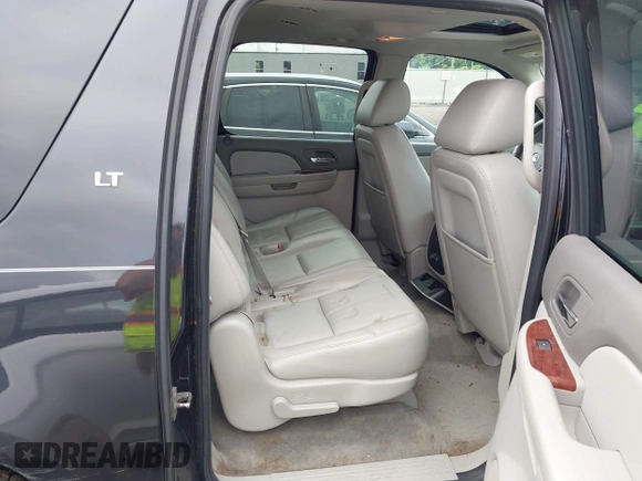 2011 Chevrolet Suburban with VIN 1GNWKMEG1BR374950, listed as a IAAI auction lot 42781182 with 304,690 mi miles and . Bid and sale history available at DreamBid. Image 8.