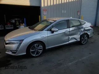 2021 Honda Clarity Touring z VIN JHMZC5F37MC002022, wystawiony jako Copart lot #77155684 z przebiegiem Nie podano mil oraz Szkoda całkowita • Salvage title. Historia ofert i sprzedaży dostępna na DreamBid. Obrazek 1.