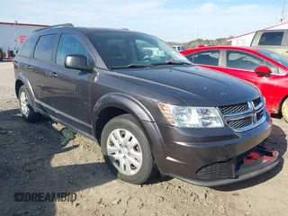 2015 Dodge Journey American Value z VIN 3C4PDCAB6FT592844, wystawiony jako IAAI lot #41120250 z przebiegiem 129 161 mil mil oraz . Historia ofert i sprzedaży dostępna na DreamBid. Obrazek 1.