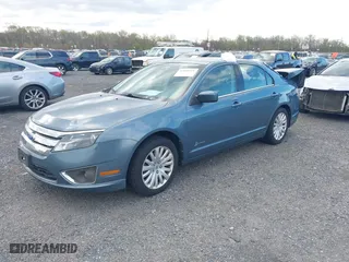 2011 Ford Fusion Hybrid with VIN 3FADP0L39BR264412, listed as a IAAI auction lot 42038511 with 134,166 mi miles. Bid and sale history available at carsss.com. Image 2.