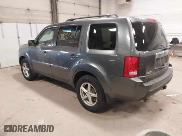 2011 Honda Pilot EX-L with VIN 5FNYF4H55BB039079, listed as a IAAI auction lot 42029278 with 173,216 mi miles. Bid and sale history available at carsss.com. Image 3.