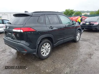 2022 Toyota Corolla Cross LE with VIN 7MUCAABG8NV004527, listed as a IAAI auction lot 42259519 with 15,211 mi miles and . Bid and sale history available at DreamBid. Image 4.