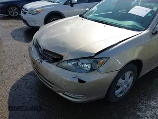 2004 Toyota Camry LE with VIN JTDBE32K440272373, listed as a IAAI auction lot 41949768 with 205,093 mi miles. Bid and sale history available at carsss.com. Image 6.