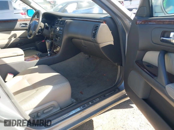 1999 Infiniti Q45 z VIN JNKBY31A8XM603290, wystawiony jako IAAI lot #41668113 z przebiegiem 144 251 mil mil oraz . Historia ofert i sprzedaży dostępna na DreamBid. Obrazek 5.