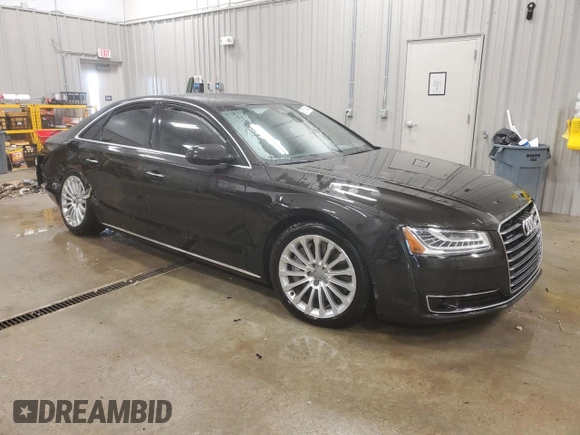 2015 Audi A8 4.0T z VIN WAUJ2AFD5FN009882, wystawiony jako Copart lot #84222704 z przebiegiem 56 118 mil mil oraz Czysty tytuł • Clean title. Historia ofert i sprzedaży dostępna na DreamBid. Obrazek 4.
