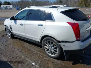 2014 Cadillac SRX Performance Collection with VIN 3GYFNFE30ES586713, listed as a IAAI auction lot 41791356 with 74,927 mi miles and . Bid and sale history available at DreamBid. Image 3.
