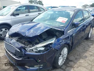 2016 Ford Focus Titanium z VIN 1FADP3J20GL208439, wystawiony jako IAAI lot #42145938 z przebiegiem 135 522 mil mil oraz . Historia ofert i sprzedaży dostępna na DreamBid. Obrazek 6.