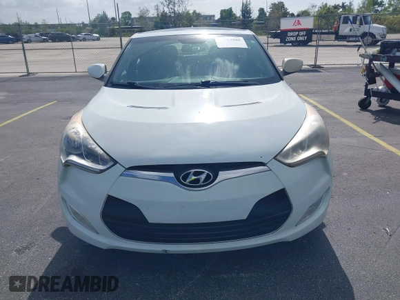 2013 Hyundai Veloster w/Gray Int with VIN KMHTC6AD0DU150516, listed as a IAAI auction lot 42164880 with 122,841 mi miles and . Bid and sale history available at DreamBid. Image 6.