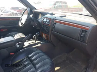 1999 Jeep Grand Cherokee Limited with VIN 1J4GW68N7XC617687, listed as a IAAI auction lot 42433705 with 186,312 mi miles and . Bid and sale history available at DreamBid. Image 5.