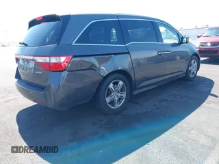 2013 Honda Odyssey Touring with VIN 5FNRL5H95DB045666, listed as a IAAI auction lot 42117219 with 50,715 mi miles and . Bid and sale history available at carsss.com. Image 4.