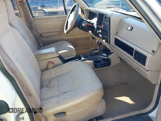 1996 Jeep Cherokee Sport with VIN 1J4FJ68S9TL234764, listed as a IAAI auction lot 41636731 with 129,732 mi miles. Bid and sale history available at carsss.com. Image 5.