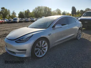 2018 Tesla Model 3 Long Range Battery with VIN 5YJ3E1EB4JF074295, listed as a Copart auction lot 74775384 with 83,515 mi miles and Salvage Title. Bid and sale history available at DreamBid. Image 1.