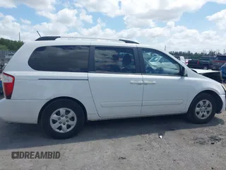 2010 Kia Sedona LX with VIN KNDMG4C33A6338047, listed as a IAAI auction lot 42128485 with 99,498 mi miles and . Bid and sale history available at carsss.com. Image 14.